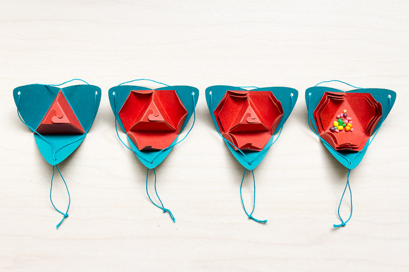 Packages in progressive stages of being opened
